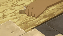 a hand is holding a piece of wood in a cartoon