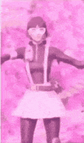 a woman in a pink dress and sunglasses is dancing .
