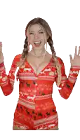 a woman in a red sweater with deer on it