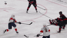 a hockey game is being played in front of a banner that says enterprise