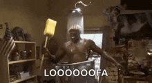 a man is taking a shower while holding a sponge in his hand .