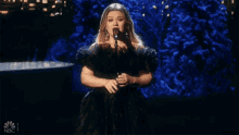 Singing Kelly Clarkson GIF - Singing Kelly Clarkson White Christmas GIFs