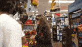 a woman wearing blindfolds in a store with a sign that says core power on it