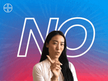 a woman holds her finger to her lips in front of a no sign