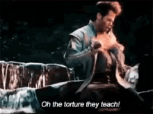 a man is sitting in front of a waterfall and says oh the torture they teach .