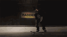 a skateboarder is doing a trick in front of a sign that says rad
