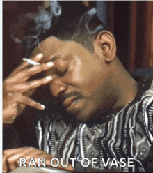 a man smoking a cigarette with the caption ran out of vase below him