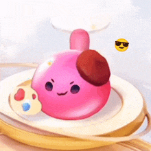 a pink cartoon character with sunglasses on is on a white plate