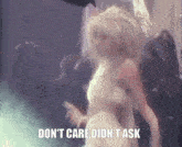 a woman dancing in the rain with the words " do n't care did n't ask " on the bottom