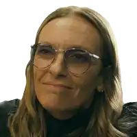 a woman wearing glasses and a black shirt is smiling