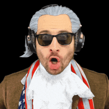 a man wearing a wig and sunglasses has a scarf around his neck that says ' liberty ' on it