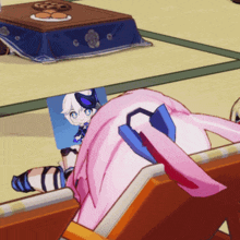 a cartoon character is laying on a couch with a blue blanket on the floor