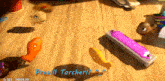 a wooden table with toys and the words prezill torcher written on it