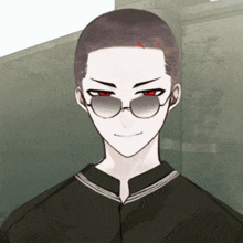 a man with a shaved head wearing sunglasses and a black jacket