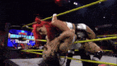 two women in a wrestling ring with a sign that says unreliable tonight