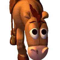 a stuffed horse with big eyes and a saddle