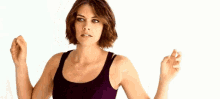 a woman in a black tank top is asking what the fuck was that