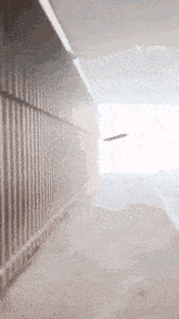 a person is walking down a hallway with a vita logo on the bottom right