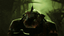 a close up of a monster 's face with horns