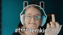 a woman wearing headphones is giving the middle finger and says # f *** demkids