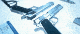 two guns and a business class ticket on a blue surface