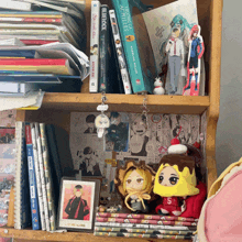 a shelf full of books including one that says " ao no exorcist "