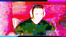 a blurry picture of a man wearing headphones .