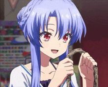 a girl with blue hair and red eyes holding a snake