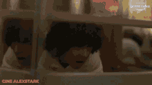 a blurry picture of a man screaming in front of a crowd with the words one alexstark in red