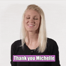 a woman says thank you michelle in front of a white background