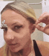 Woman Peeling Off Ear Stantwt GIF
