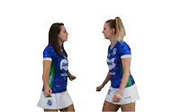 two women wearing blue shirts that say itambé minas 7