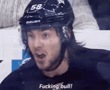 a hockey player with the number 58 on his helmet says " fucking bull "