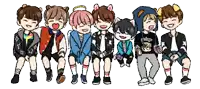 a group of young boys are sitting next to each other