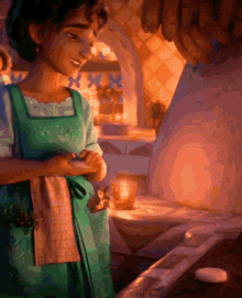 a woman in a green apron stands in front of a stove
