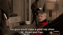 You Guys Would Make A Great Cop Show Mr Brown And Fran Roland Blum GIF - You Guys Would Make A Great Cop Show Mr Brown And Fran Roland Blum Michael Sheen GIFs