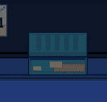a cartoon character is sitting in a blue box with a bunch of clothes in it .