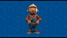 bob the builder stands in front of a blue background with tools on it