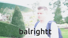 a blurry picture of a man with a backpack and the word balrightt on the bottom