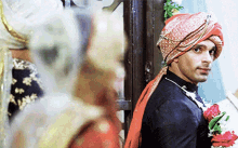 a man in a turban is standing next to a woman in a wedding dress