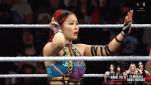 a woman in a wrestling ring with the words damage girl vs liv morgan and raquel rodriguez