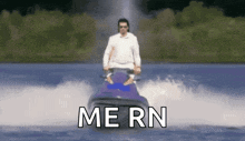 a man is riding a jet ski in the water and the words me rn are above him