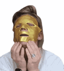 face mask applying gold showing off bunny meyer