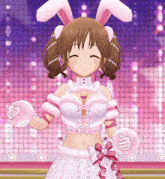 a girl wearing bunny ears and gloves is smiling and giving a thumbs up