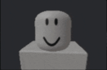 a white block with a smiley face on it 's face