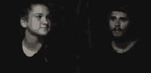 a blurry photo of a man and a woman in a dark room