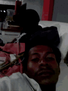 a person laying on a bed with their head down