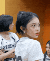 a girl wearing a white jersey with the number 14 on it