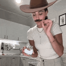 a woman wearing a cowboy hat and a fake mustache holds a glass