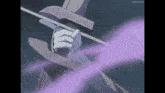 a person in a top hat is holding a sword in their hand .